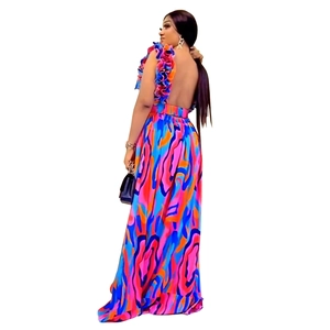 Close-up of vibrant abstract floral print long dress with ruffled shoulder straps