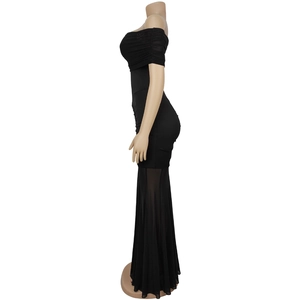 Detail of off-shoulder ruched black maxi dress with mesh fishtail hemline on mannequin