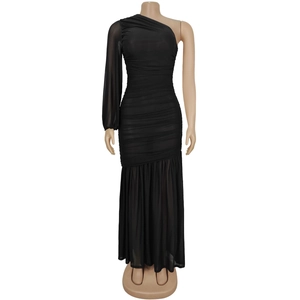 Detail of elegant black one-shoulder dress featuring ruched fabric and sheer mesh long sleeve