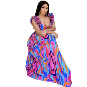 Detail of elegant ruffle shoulder straps on a multicolor printed long maxi dress