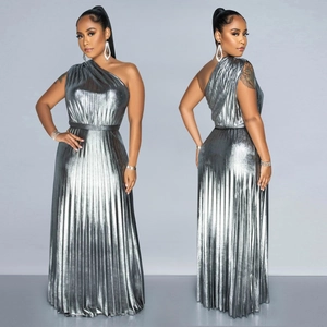 Close-up of silver pleated fabric and one-shoulder detail on the elegant maxi dress