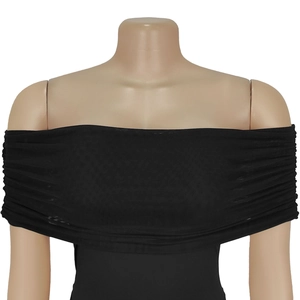 Detail of black off-the-shoulder mesh dress with ruched texture on a studio mannequin