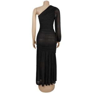 Detail view of black one-shoulder ruched mesh dress showing sheer sleeve and elegant textures