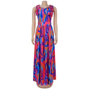 Detail of ruffle straps and sweetheart neckline on abstract print maxi dress