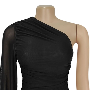 Detail of the elegant ruched mesh fabric and one-shoulder sleeve on this black chic dress