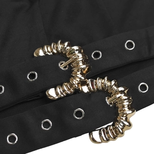 Detailed macro view of gold ridged buckles and silver eyelets on black fabric