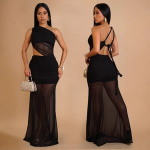 Detail of black off-shoulder mesh dress featuring open back with lace-up cross straps