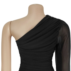 Detail of black one-shoulder dress with elegant ruching and sheer mesh long sleeve