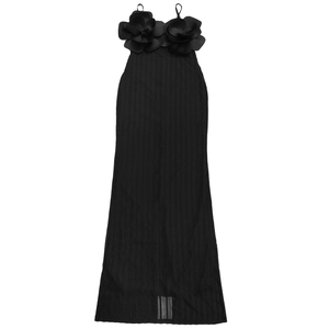 Detailed view of the black knitted maxi dress featuring 3D floral corsage accents