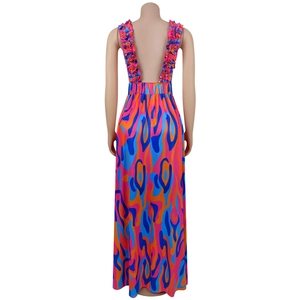 Detail view of the back showing abstract wave print dress with ruffle straps and open back