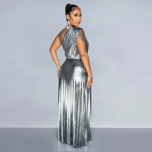 Detail showing the shiny silver metallic fabric and vertical pleats of the one-shoulder dress