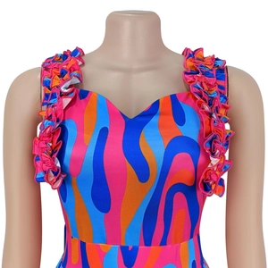 Detail of sweetheart neckline and ruffled straps on colorful floral print dress