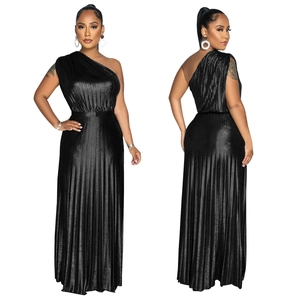 Detail view of the fine pleats and shimmering fabric on the black one-shoulder gown