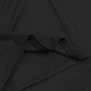 Detailed close-up of double-stitched hem on soft black knit v-neck top and pants set