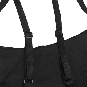 Detail of adjustable black elastic shoulder straps with matte buckles on lace dress