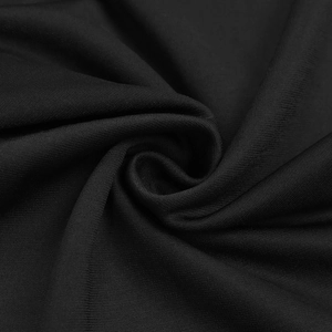 Close-up of premium black knit fabric texture showing fine weave and soft drape detail