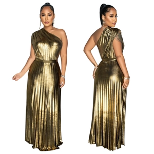 Detailed view of the elegant gold metallic pleated texture on a one-shoulder maxi dress