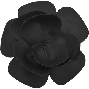 Detail of the black fabric camellia flower embellishment on the backless lace dress