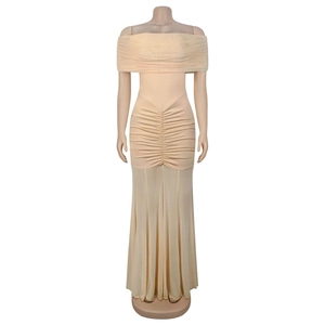 Detail of off-the-shoulder ruched bodice and sheer mesh skirt on long evening dress