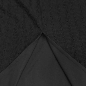 Detailed close-up of a sexy black lace slit dress highlighting textured stripe fabric