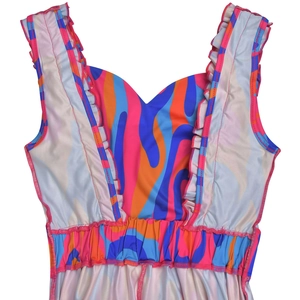Detail of floral printed dress featuring ruffled straps and elastic pleated waistline