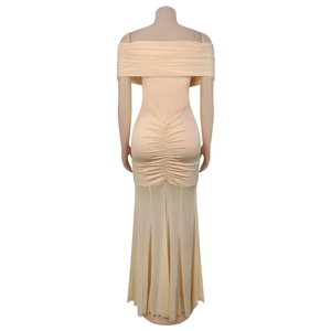 Detail of the elegant ruched back and mermaid silhouette of the off-shoulder dress