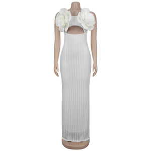 Close-up of white dress with 3D floral appliques and circular cutout detail