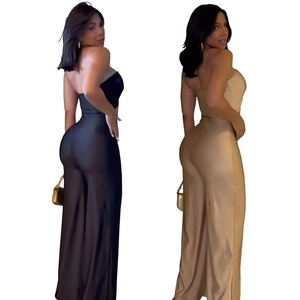 Detail of elegant black and champagne strapless wide-leg jumpsuits with a silky finish