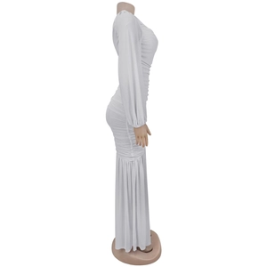 Detail of white long-sleeved dress featuring elegant ruching and premium mesh fabric