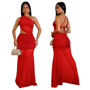 Detail of red ruched dress featuring one-shoulder cut and lace-up back design