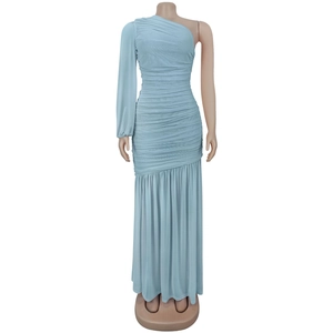 Detail of light blue one-shoulder mesh maxi dress with elegant ruched texture and pleats