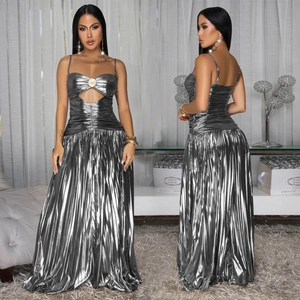 Detail of silver metallic dress featuring pleated skirt and cutout bodice in high-gloss fabric
