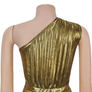 Detail of elegant gold pleated one-shoulder dress showing metallic fabric texture