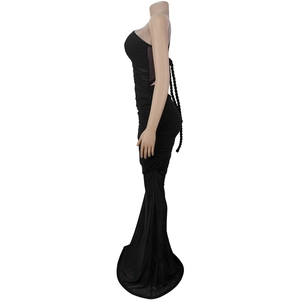 Detail view of black bodycon dress featuring elegant side ruching and braided back straps