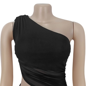 Detail of black one-shoulder dress showing sheer mesh panel and pleated knit texture