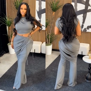 Front and back views of grey sleeveless crop top and ruched trousers two-piece set