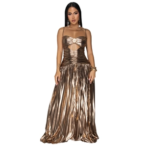 Detail of bronze metallic pleated dress featuring center pearl buckle and cutout