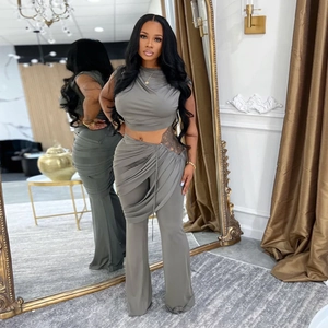 Women's 2-piece grey set featuring a sleeveless crop top and high-waisted flared pants