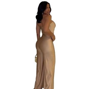 Side view of a slim fit beige strapless wide-leg jumpsuit for women on a white background