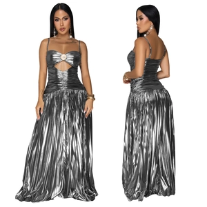 Detail view showing silver metallic pleated maxi dress with heart cutout and pearl buckle