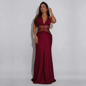 Close-up of elegant burgundy V-neck evening dress with intricate lace waist detailing
