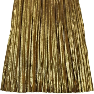 Detail of the golden metallic pleated fabric texture on an elegant sleeveless dress