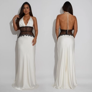 Close-up of elegant V-neck dress with black lace patchwork and open back design