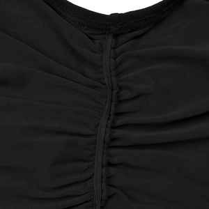 Detailed close-up of black mesh dress fabric featuring ruched texture and elastic seam