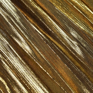 Close-up of golden metallic pleated fabric with champagne gold shimmer and vertical texture