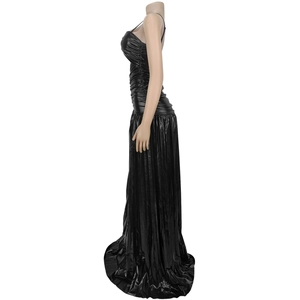Detail of elegant black shimmering floor-length dress with delicate thin straps and pleated fabric
