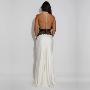 Detail of elegant backless lace bodice with satin mermaid skirt on a stylish dress
