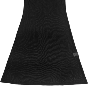 Close-up of sheer black mesh fabric detailing with seamless edges and care label