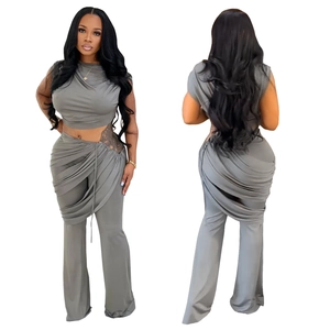 Front and back view of grey two-piece set with cropped top and pleated high waist pants