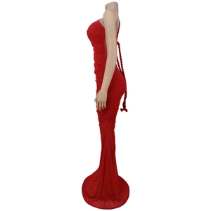 Detail of red bodycon fishtail dress featuring horizontal pleats and lace-up back design